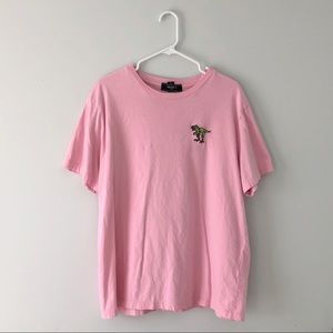 Means pink Dino logo tee